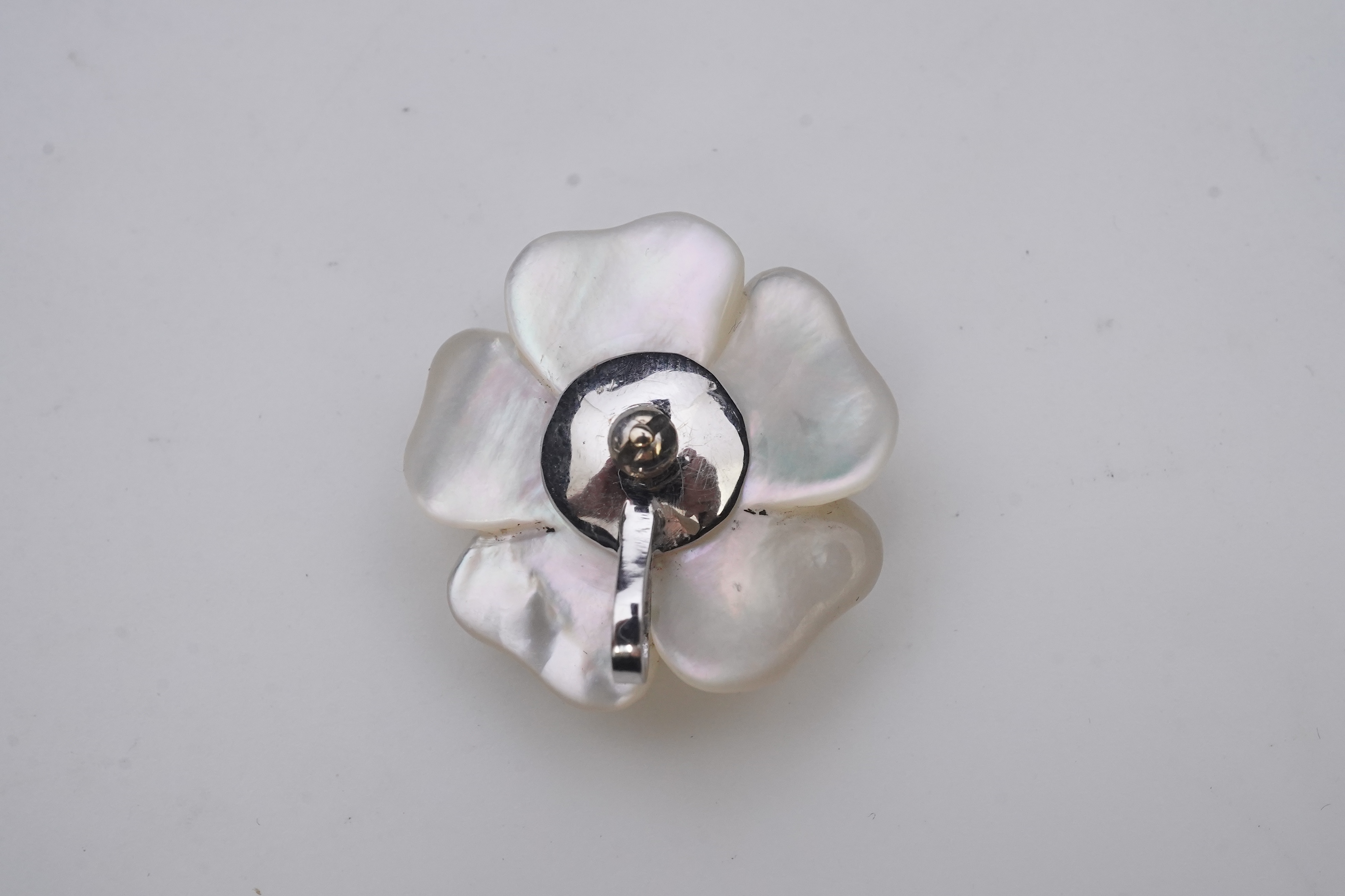 A mother of pearl and diamond pendant